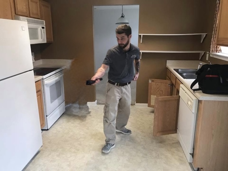 Home inspector checking the kitchen area during a home inspection in Winston-Salem NC.