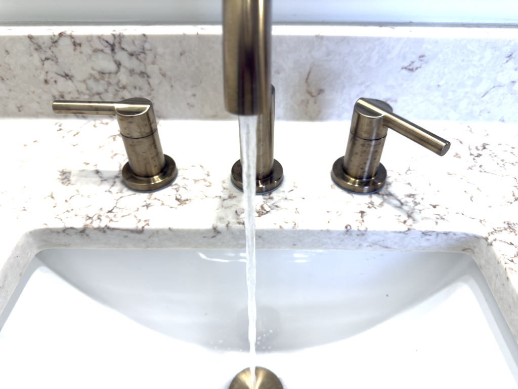 Clear water running from a faucet during a home water quality testing in Greensboro.